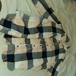 A checkerd button up shirt.